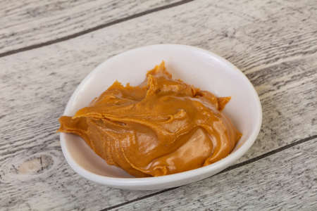 Tasty peanut butter in the bowlの写真素材