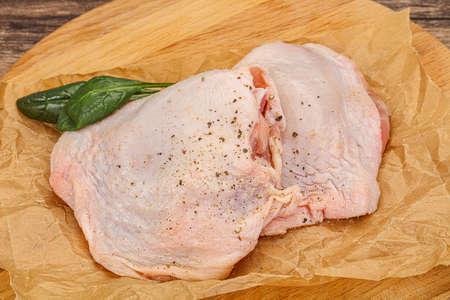 Raw chicken hip with spices ready for cookingの写真素材