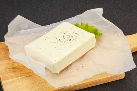 Greek cheese feta over board, still-life