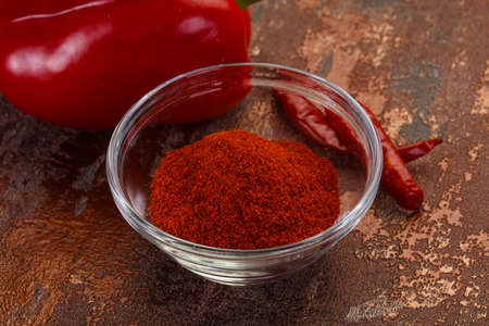 Sweet Paprika powder in the bowlの写真素材