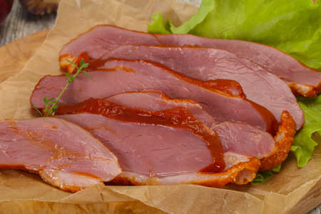 Sliced smoked duck breast served salad leafの写真素材