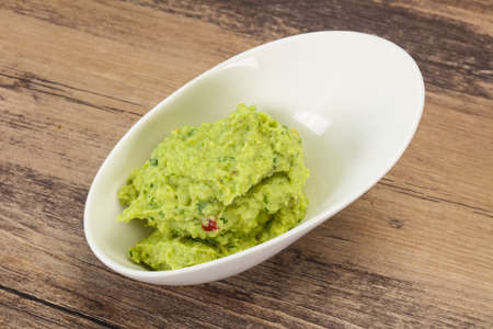 Spicy Avocado guacamole sauce with chili pepperの写真素材