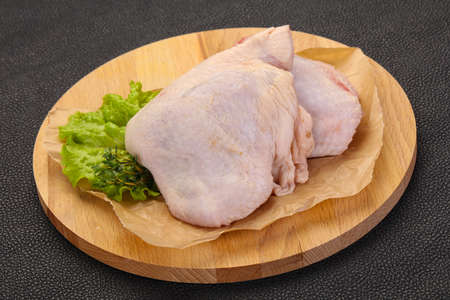 Raw chicken hip ready for cookingの写真素材
