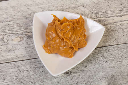 Tasty peanut butter in the bowl