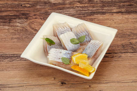 Marinated Herring fillet with sliced lemon