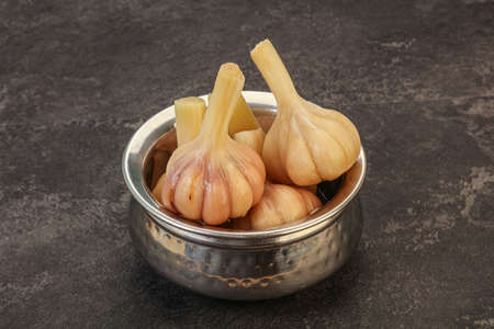 Marinated young garlic in the bowlの写真素材
