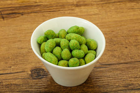 Spicy wasabi peanuts snack in the bowlの写真素材