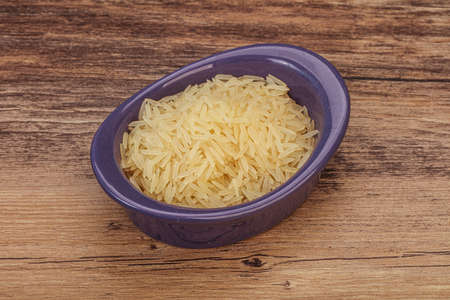 Raw Indian basmati rice in the bowlの写真素材