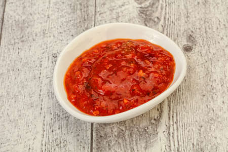 Tomato hot spicy sauce in the bowlの写真素材