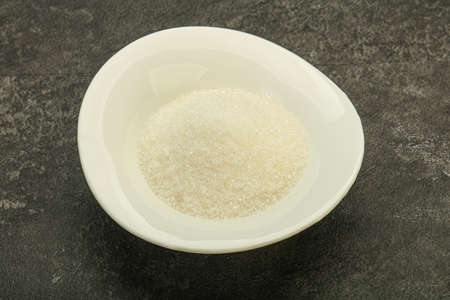 White sweet sugar in the bowl