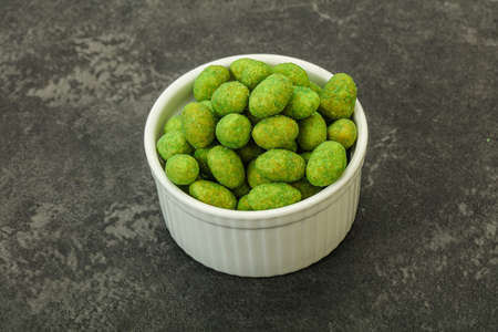 Spicy wasabi peanuts snack in the bowlの写真素材