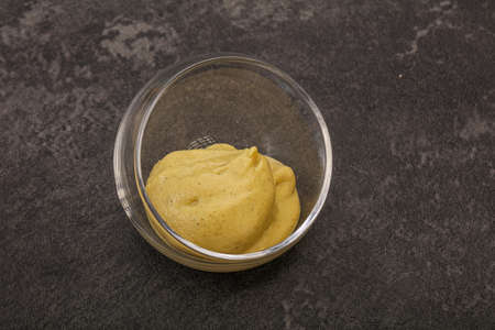 Dijon mustard dip sauce in the bowlの写真素材