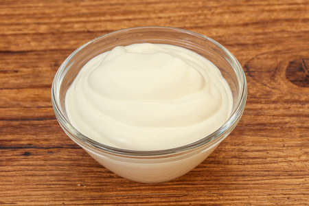 Dairy sour cream in the bowlの写真素材