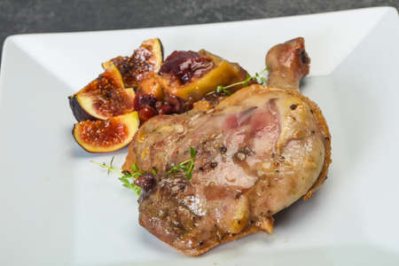 Roasted. duck. leg with plum, fig and appleの写真素材