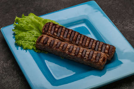 Two Grilled kebeb beef sausages with spicesの写真素材