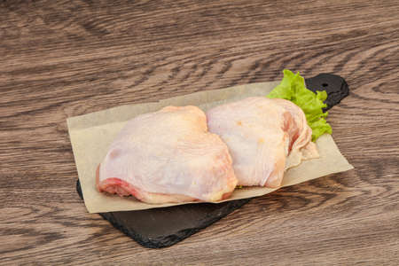 Raw chicken hip ready for cookingの写真素材