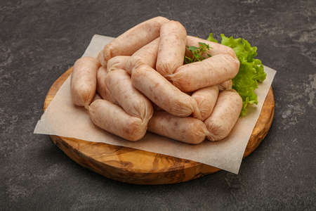 Raw natural chicken baby sausages for roastの写真素材