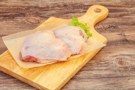 Raw chicken hip ready for cookingの写真素材
