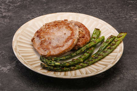 Grilled tuna steak with green asparagusの写真素材