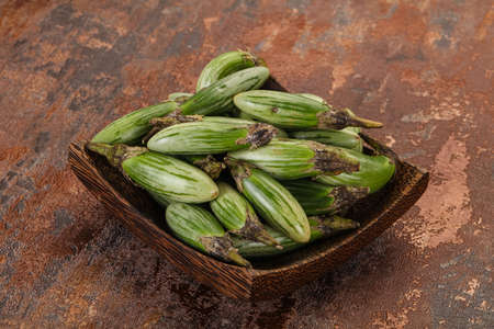 Green asian eggplant in the bowlの写真素材