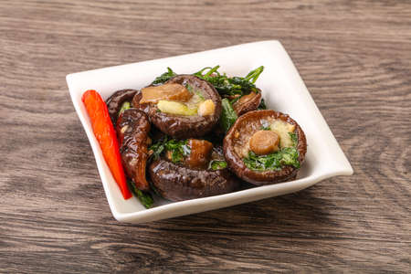 Marinated shiitake mushrooms with herbs and spicesの写真素材