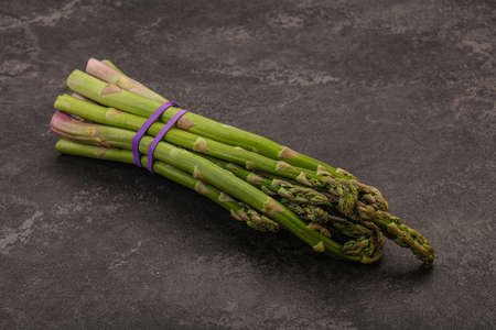 Vegan cuisine - Raw asparagus heap for cookingの写真素材