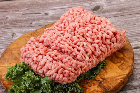 Raw pork minced meat with spices for cookingの写真素材