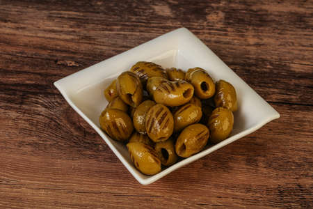 Tasty Green grilled olives in the bowlの写真素材