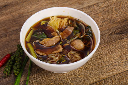Thai style soup with meat, vegetables and mushroomsの写真素材