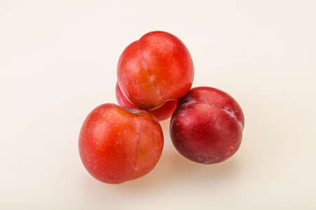 Ripe sweet tasty red plum heapの写真素材