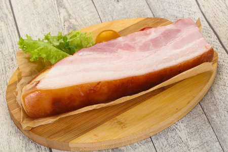 Smoked pork breast with salad leaves and tomatoesの写真素材