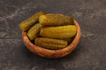 Pickled sour cucumbers in the plateの写真素材