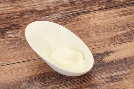 Dairy sour cream in the bowlの写真素材