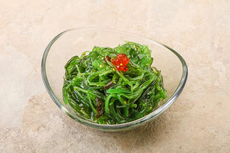 Asian traditional chukka salad in the bowl served red caviarの写真素材