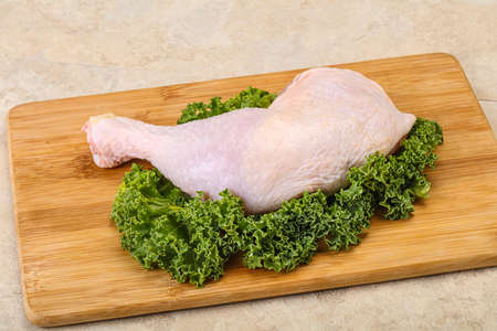 Raw uncooked chicken leg for cookingの写真素材