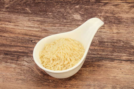 Raw Indian basmati rice in the bowlの写真素材