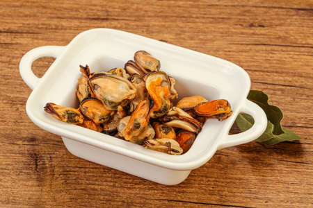 Pickled mussels with spices in the bowlの写真素材