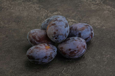 Purple sweet ripe tasty plum heapの写真素材
