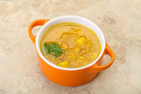 Pea soup with smoked meat and vegetablesの写真素材