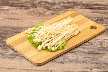 Raw Japanese Enoki mushrooms for cooking