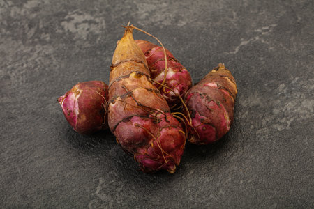 Vegan suisine - Raw topinambur root or Jerusalem artichokeの写真素材