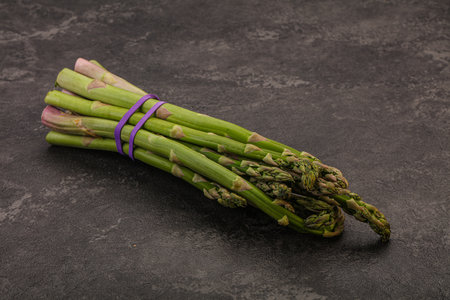 Vegan cuisine - Raw asparagus heap for cookingの写真素材