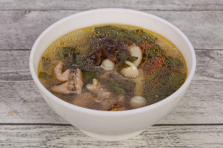 Thai style soup with meat, vegetables and mushroomsの写真素材