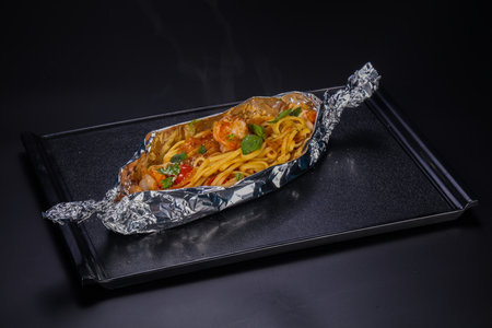 Spaghetti with prawn and tomato served basilの写真素材