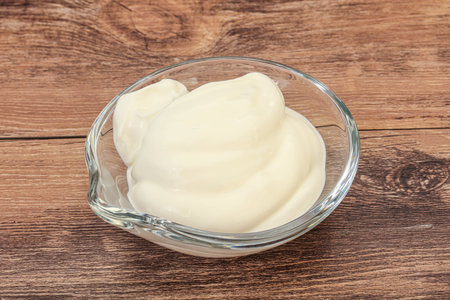 Dairy sour cream in the bowlの写真素材