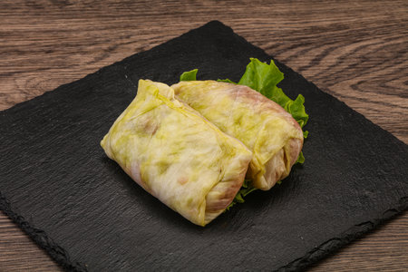 Homemade raw stuffed cabbage with meat for cookingの写真素材
