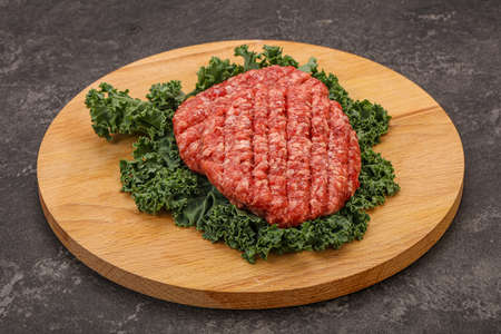 Raw beef burger cutlet for grillの写真素材