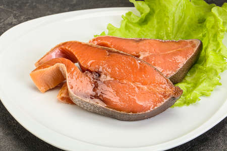 Two pink salmon fish steak served salad leavesの写真素材