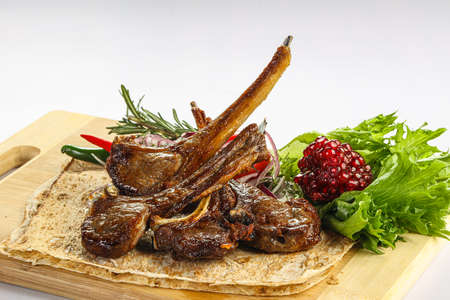 Grilled delicous lamb chops barbeque served rosemaryの写真素材
