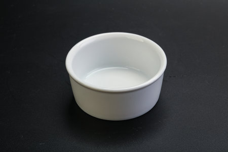 White proclean bowl for serving over blackの写真素材